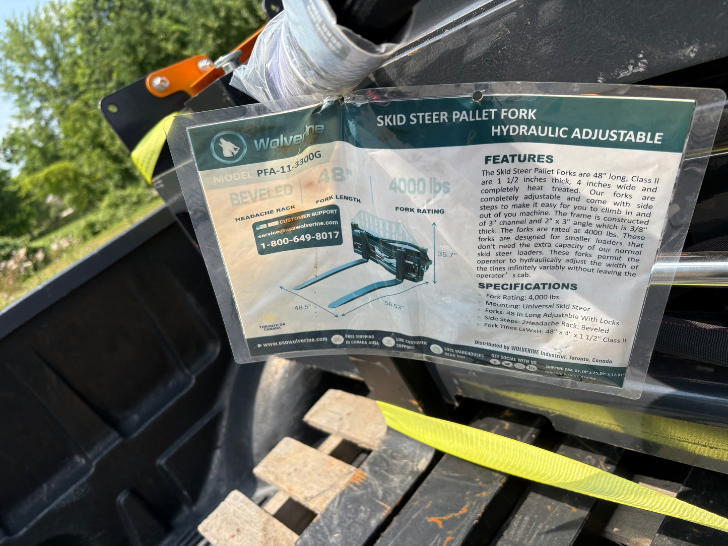Skid steer adjustable forks