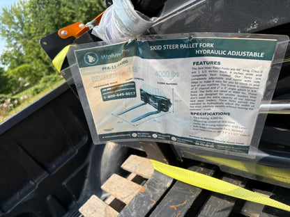 Skid steer adjustable forks