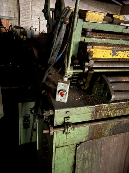 Row coil cradle and straightener
