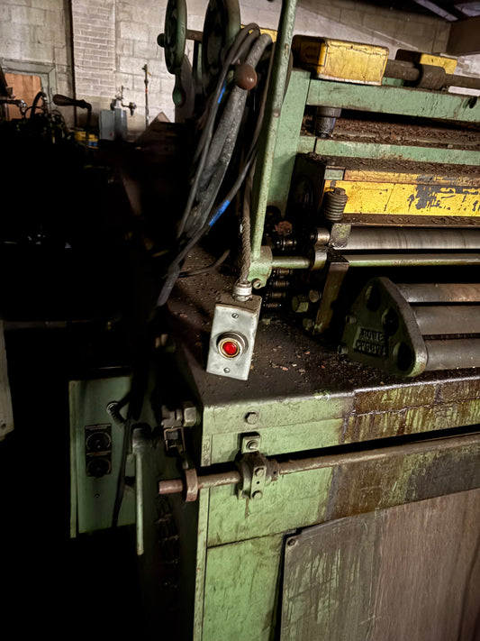 Row coil cradle and straightener